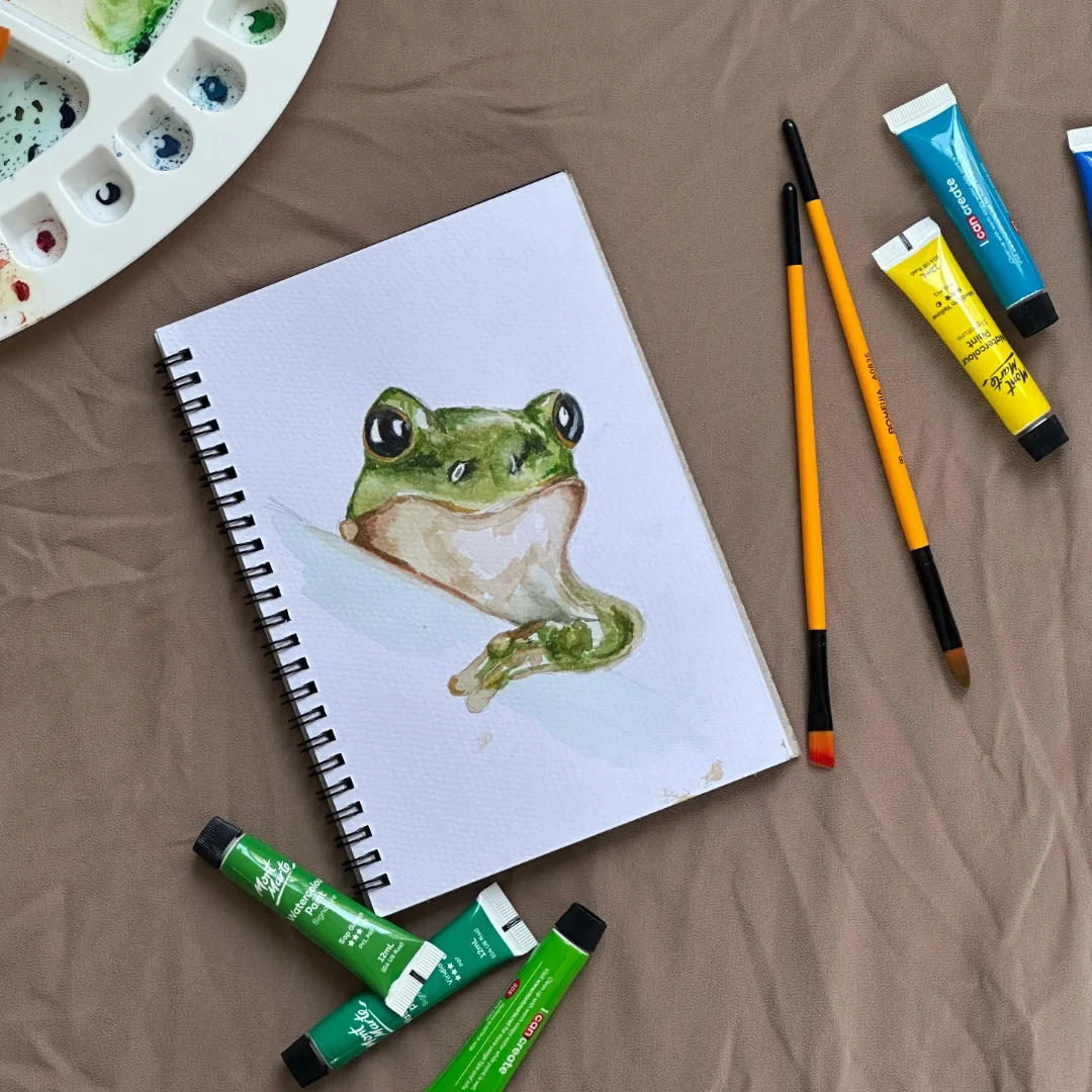 Watercolour frog painting in sketchbook