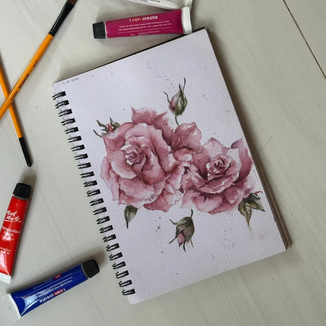 Watercolour pink roses in sketchbook